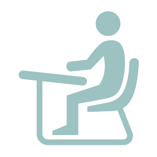 Icon of a person at a desk in teal